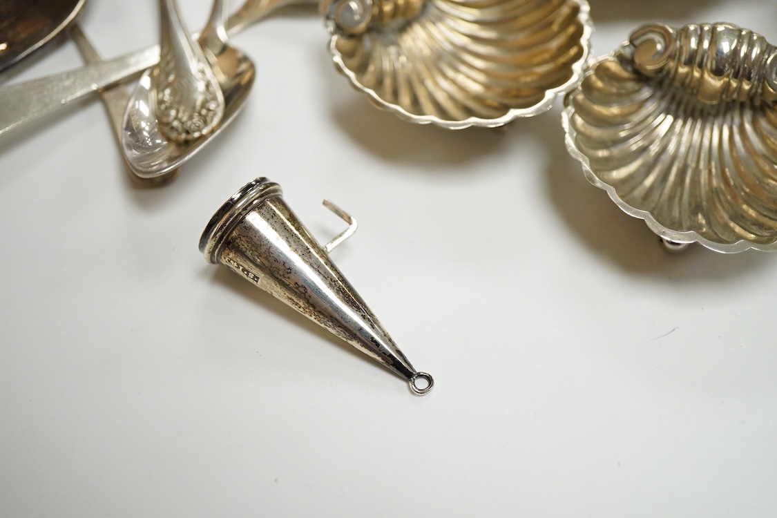 A collection of small silver, to include a late Victorian seven bar toast rack, by Edward Gilbert, London, 1887, length 13.3cm, a late Victorian bowl, pair of shell salts, nut dish, egg cup, Georgian chamberstick(part of